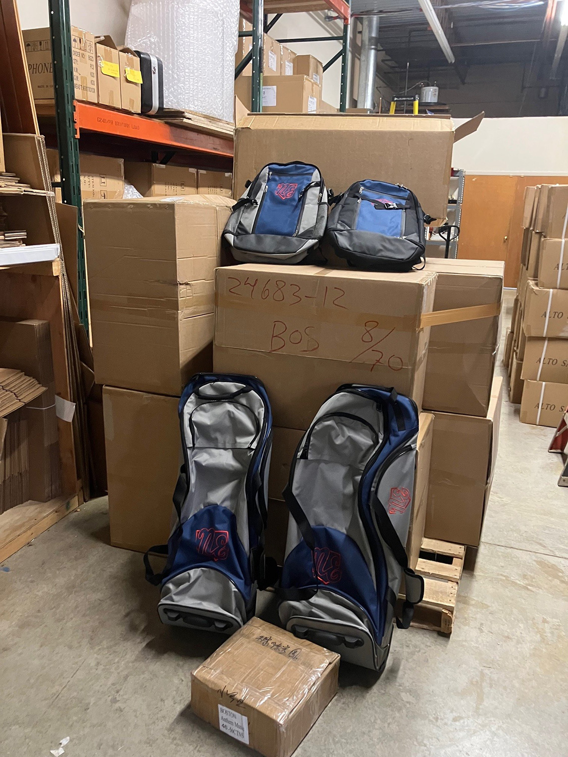 Shipment of Rango Sports custom baseball and softball bags in a warehouse