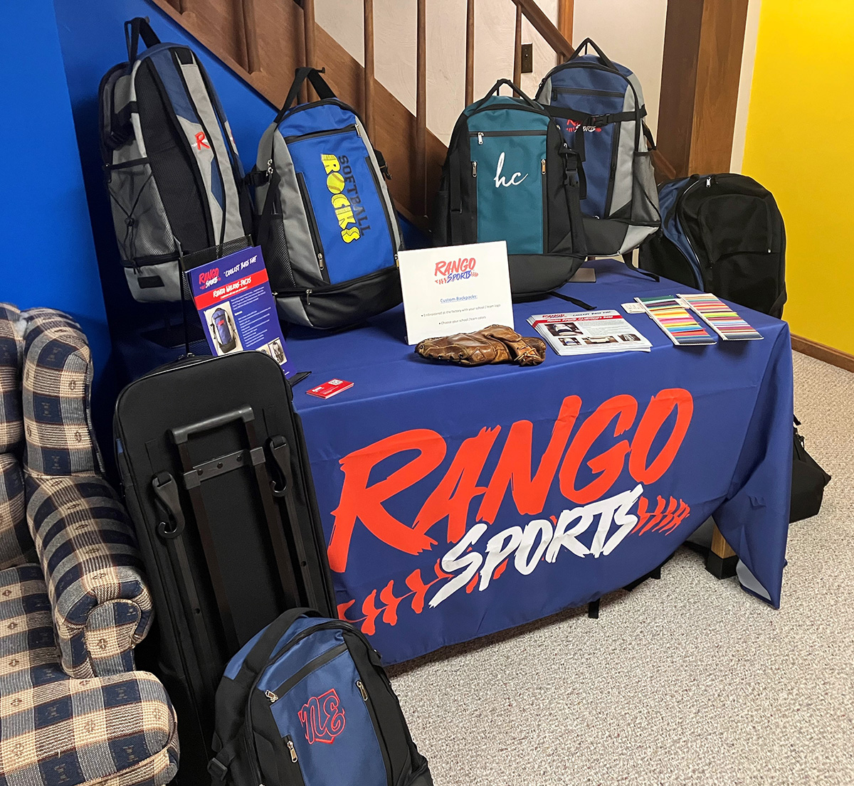 The Rango Sports booth set up in a basement