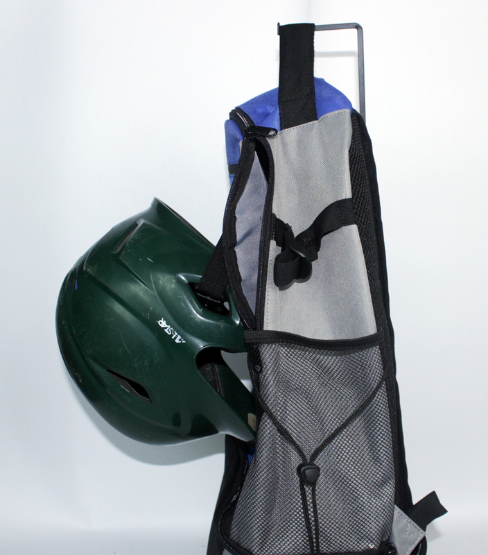 Rango Sports Walrus-Pack demonstrating the secure helmet strap from the side using a green helmet