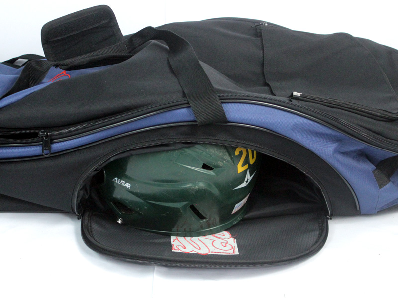 Extra side pocket storage on Rango Sports Clubhouse baseball bag. Helmet in the side pocket to demonstrate size